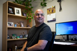 Terry Fiscus, a counselor at Turning Point Community Programs, sits in his office in Sacramento on Thursday, June 23, 2022. Photo by Nina Riggio for CalMatters