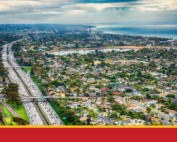 Aerial view of San Diego County with freeway bisecting neighborhoods