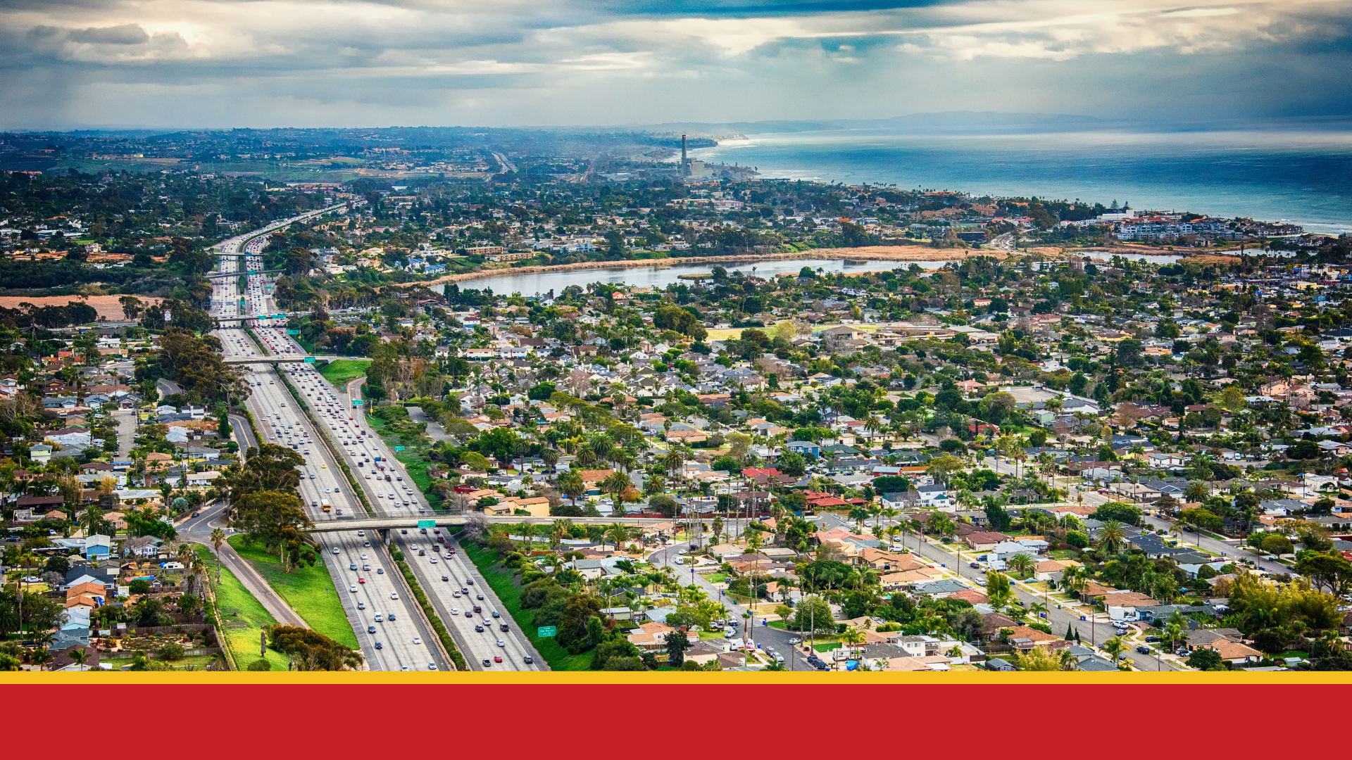 Aerial view of San Diego County with freeway bisecting neighborhoods