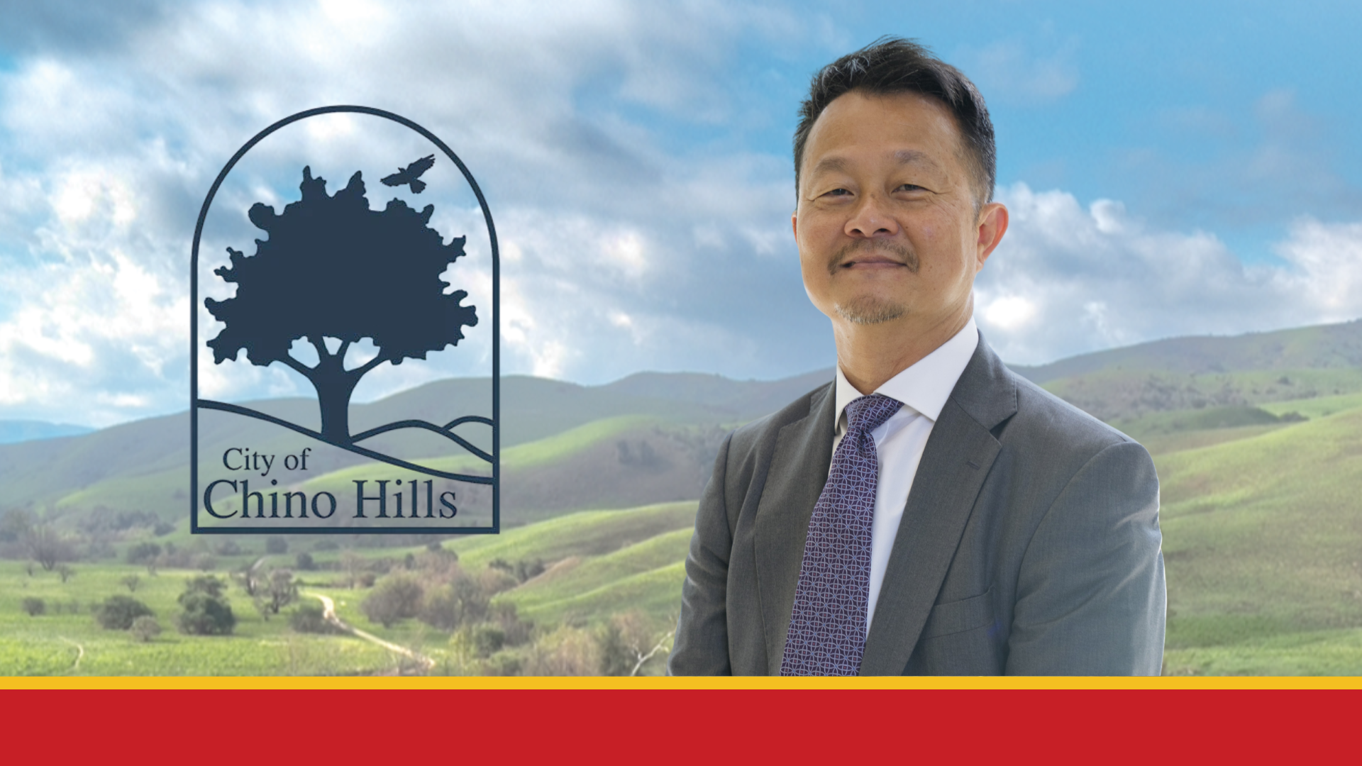 Profile of a man in a grey suit smiling next to the City of Chino Hills logo in front of a transparent backdrop of the City of Chino Hills hillside.